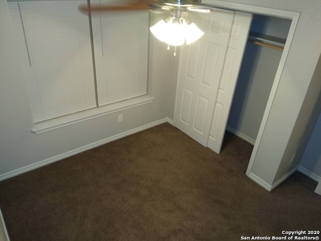 112 Lone Oak, Unit D102 Floresville, TX 78114 - Photo 18 of 34 a view of a room with a mirror