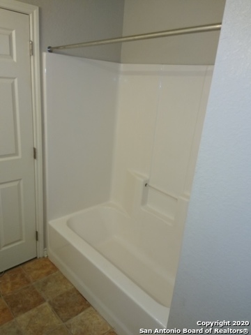112 Lone Oak, Unit D102 Floresville, TX 78114 - Photo 24 of 34 a bathroom with a shower