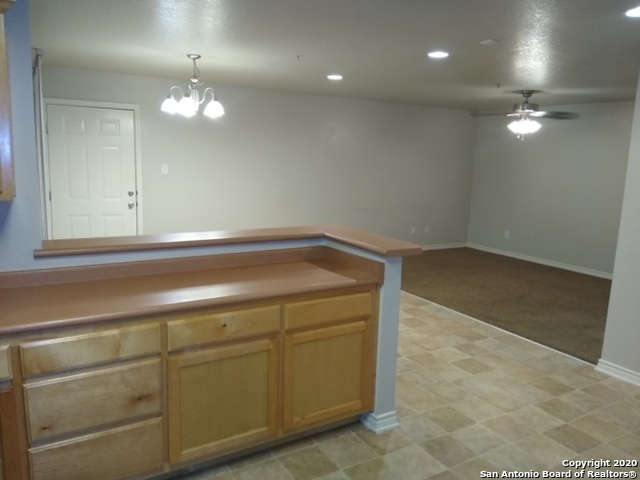 112 Lone Oak, Unit D102 Floresville, TX 78114 - Photo 7 of 34 a view of a livingroom with kitchen appliances