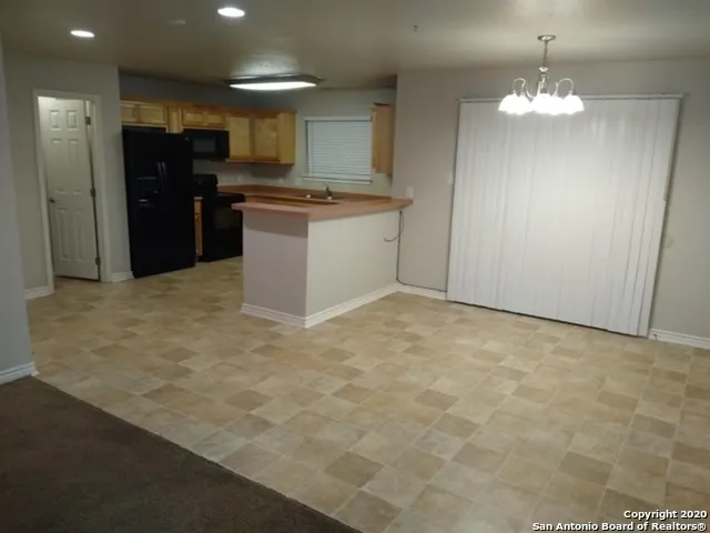 en empty room with wooden floor