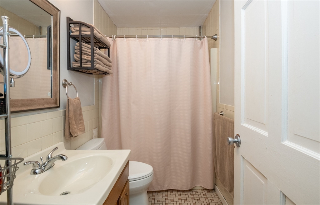 96 Derby Street, Unit 1 Salem, MA 01970 - Photo 15 of 31 a bathroom with a sink toilet and shower