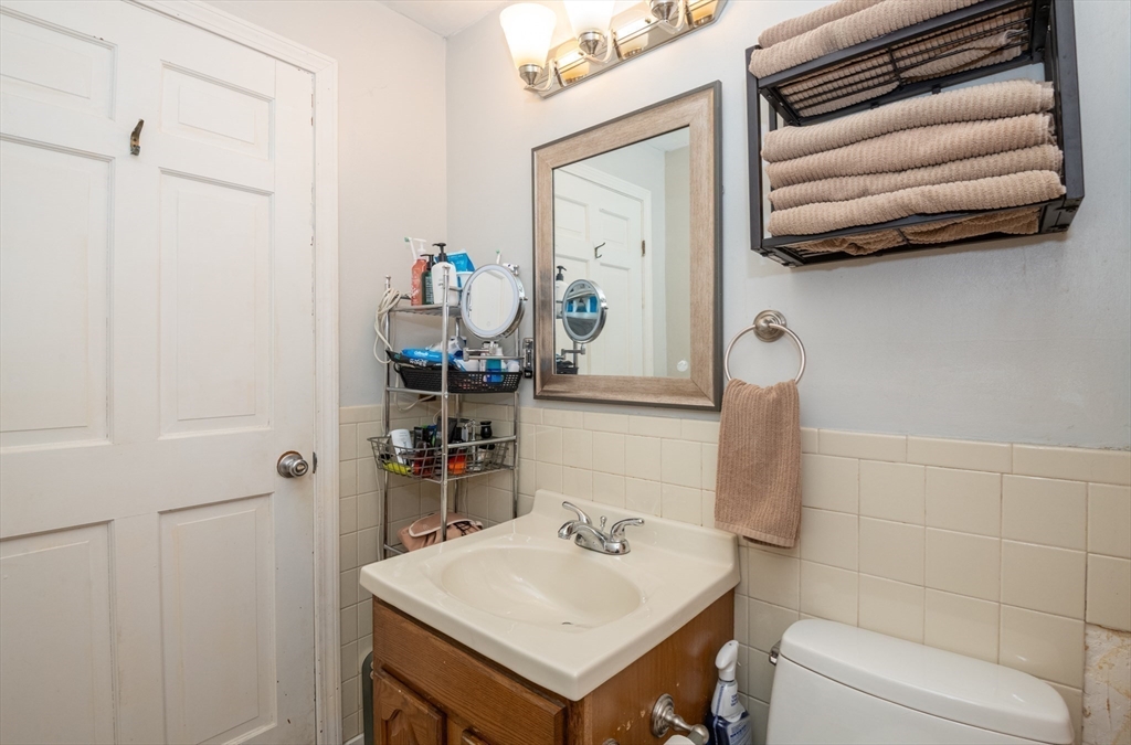 96 Derby Street, Unit 1 Salem, MA 01970 - Photo 16 of 31 a bathroom with a sink and a mirror