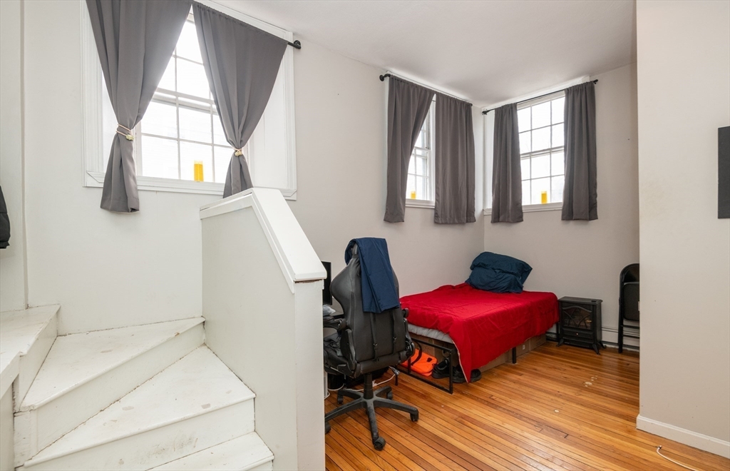 96 Derby Street, Unit 1 Salem, MA 01970 - Photo 18 of 31 a view of a workspace with furniture and a window