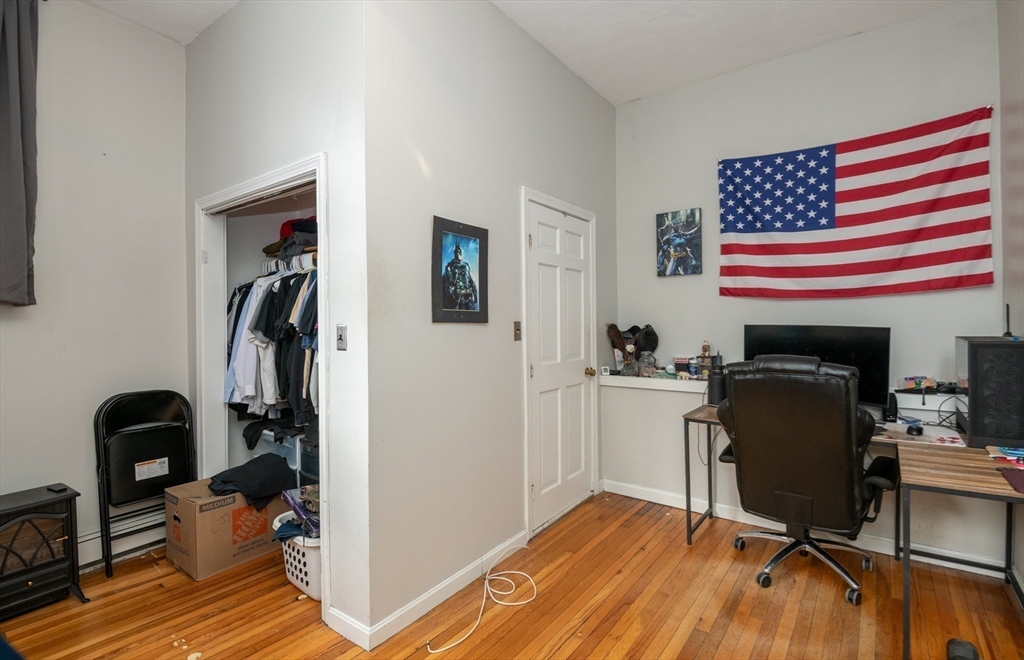96 Derby Street, Unit 1 Salem, MA 01970 - Photo 21 of 31 a view of a workspace with furniture and gym equipment