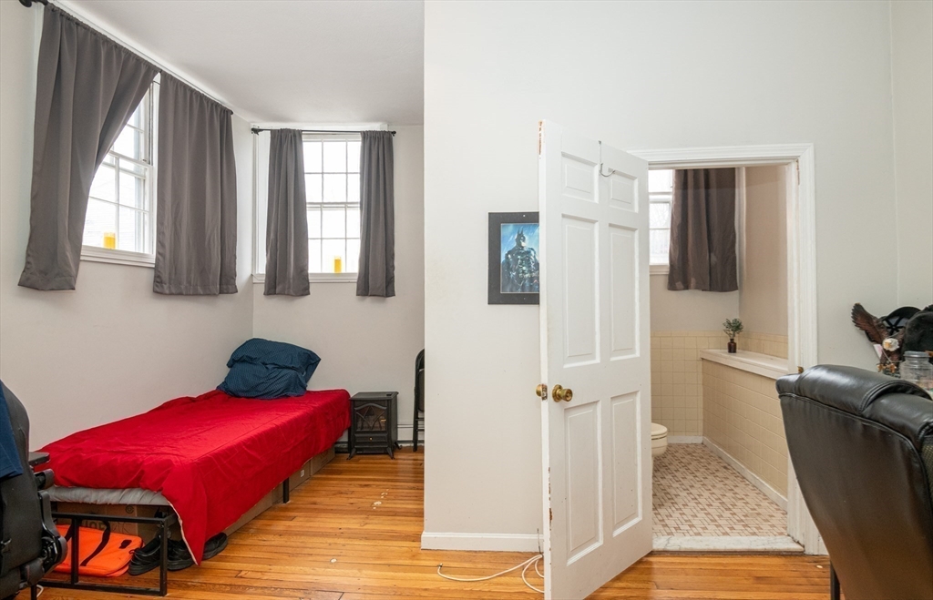 96 Derby Street, Unit 1 Salem, MA 01970 - Photo 22 of 31 a bathroom with a tub toilet and sink
