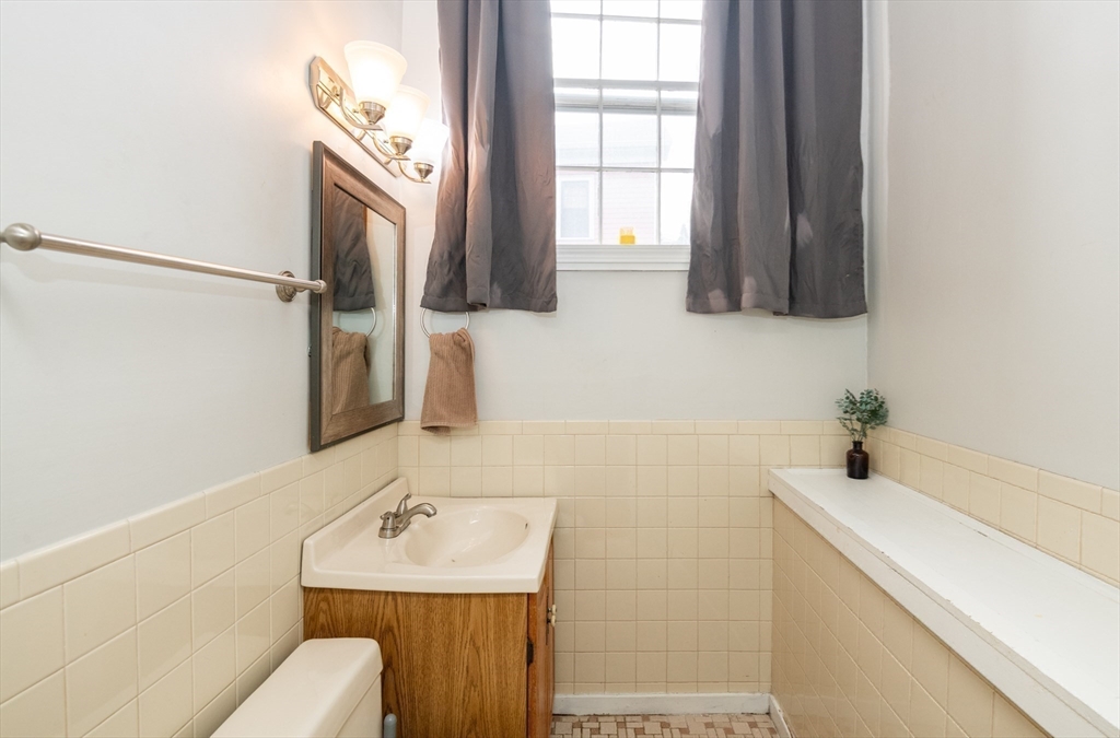 96 Derby Street, Unit 1 Salem, MA 01970 - Photo 23 of 31 a bathroom with a sink and a mirror