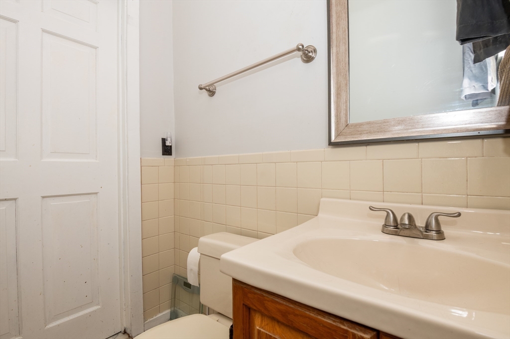 96 Derby Street, Unit 1 Salem, MA 01970 - Photo 24 of 31 a bathroom with a sink and a toilet
