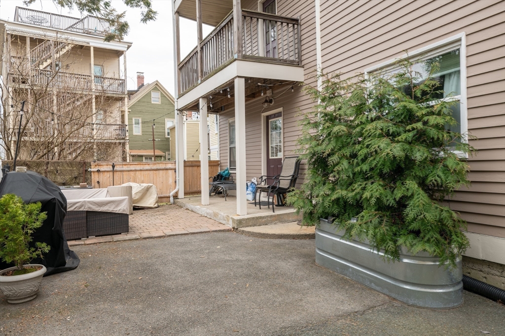 96 Derby Street, Unit 1 Salem, MA 01970 - Photo 25 of 31 a front view of a house with garden