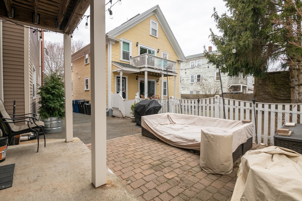 96 Derby Street, Unit 1 Salem, MA 01970 - Photo 26 of 31 a front view of a house with garden