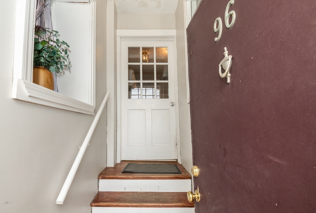 96 Derby Street, Unit 1 Salem, MA 01970 - Photo 3 of 31 a view of staircase with white walls and a window