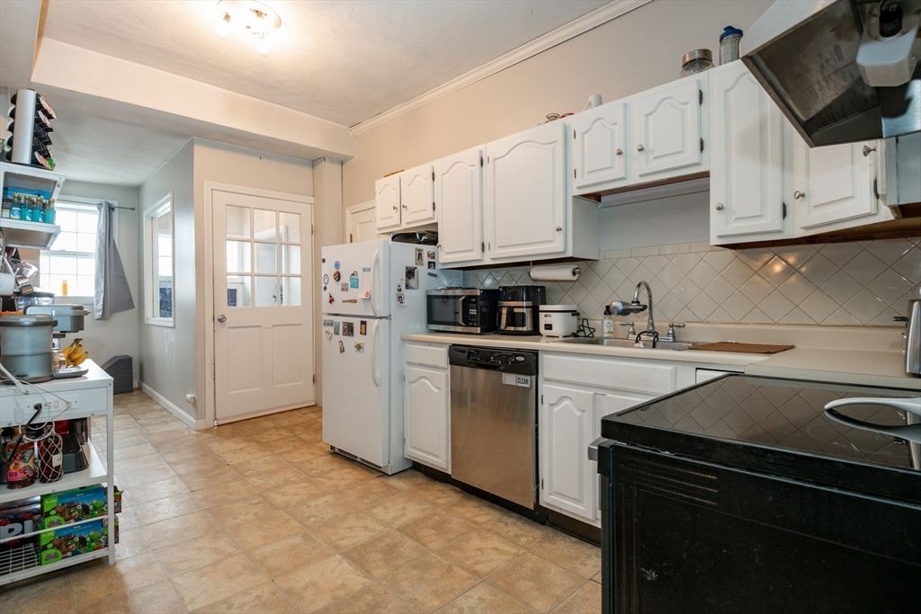 96 Derby Street, Unit 1 Salem, MA 01970 - Photo 7 of 31 a kitchen with cabinets appliances and a sink