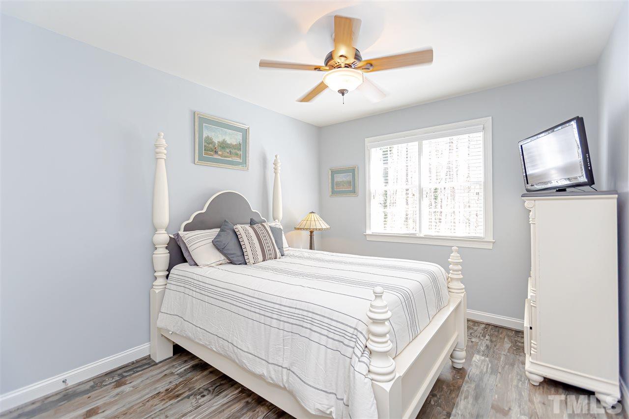 9408 Ray Road Raleigh, NC 27613 - Photo 14 of 30 a bedroom with a bed and a window
