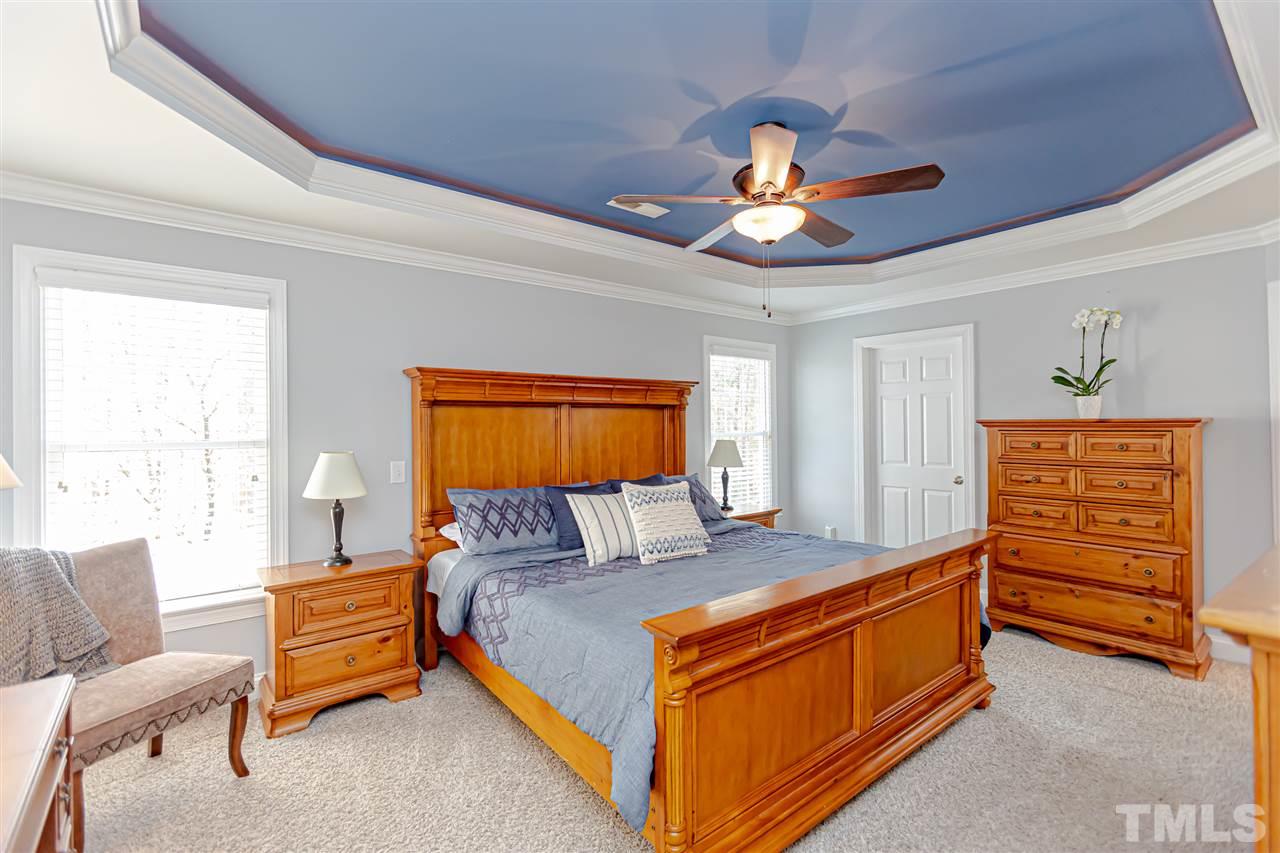 9408 Ray Road Raleigh, NC 27613 - Photo 17 of 30 a bedroom with a bed and a couch