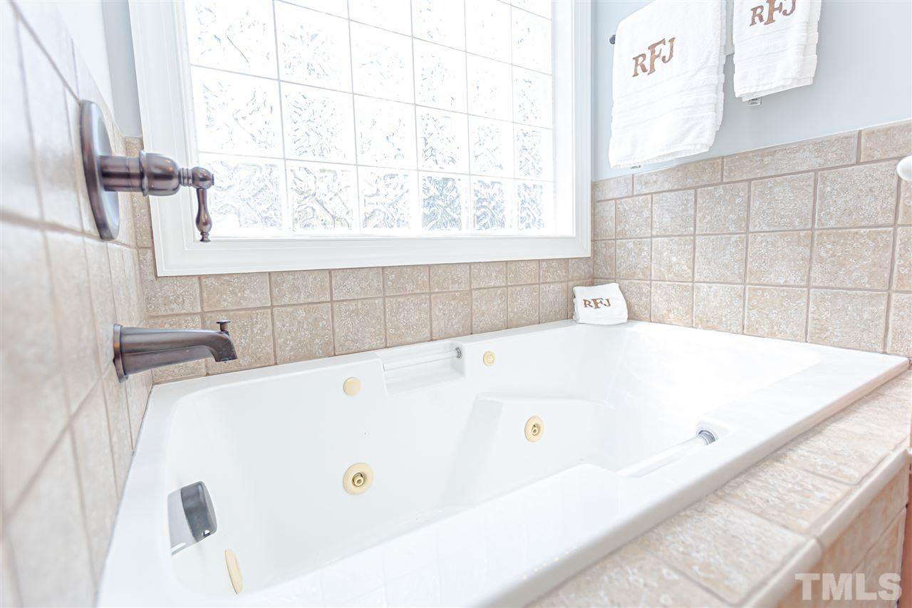 9408 Ray Road Raleigh, NC 27613 - Photo 19 of 30 a bathroom with a bathtub