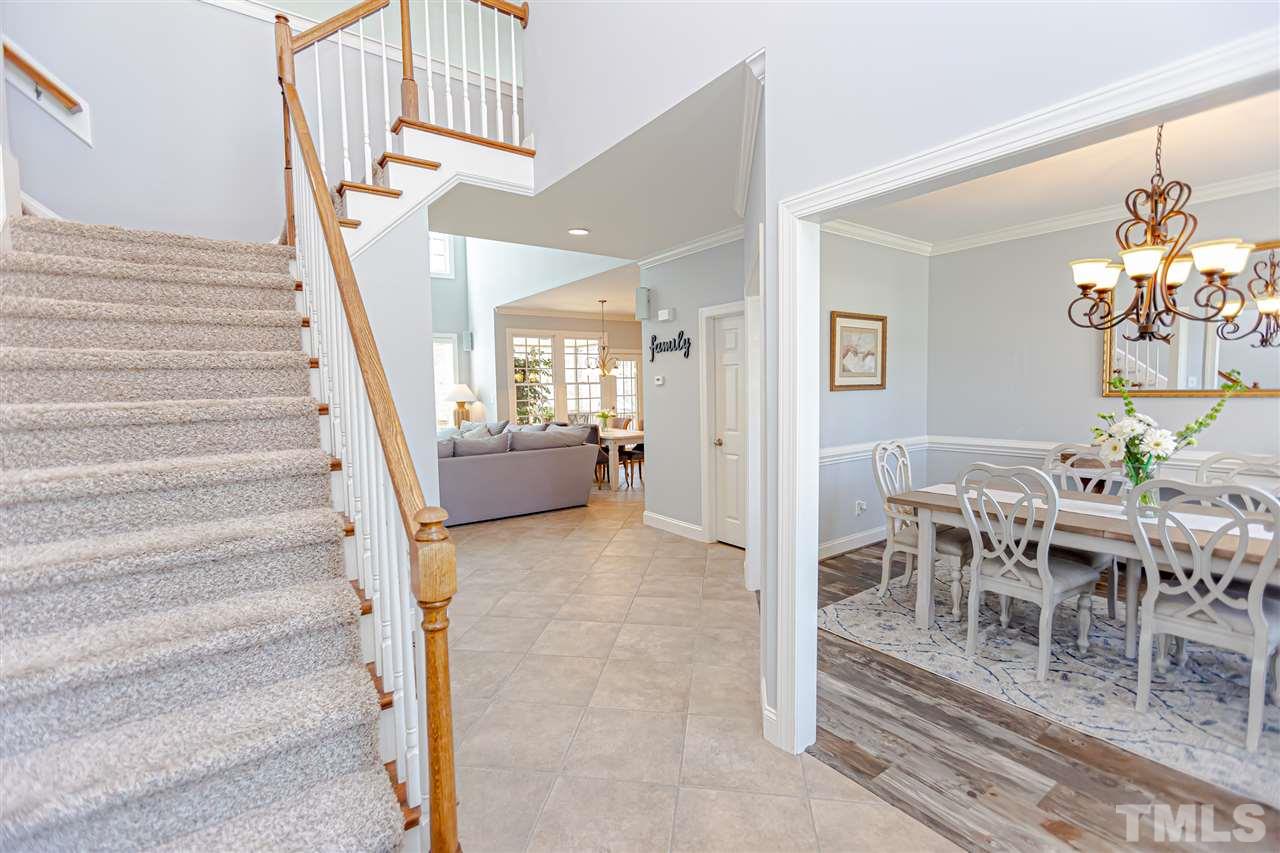 9408 Ray Road Raleigh, NC 27613 - Photo 5 of 30 a view of a livingroom with furniture and stairs