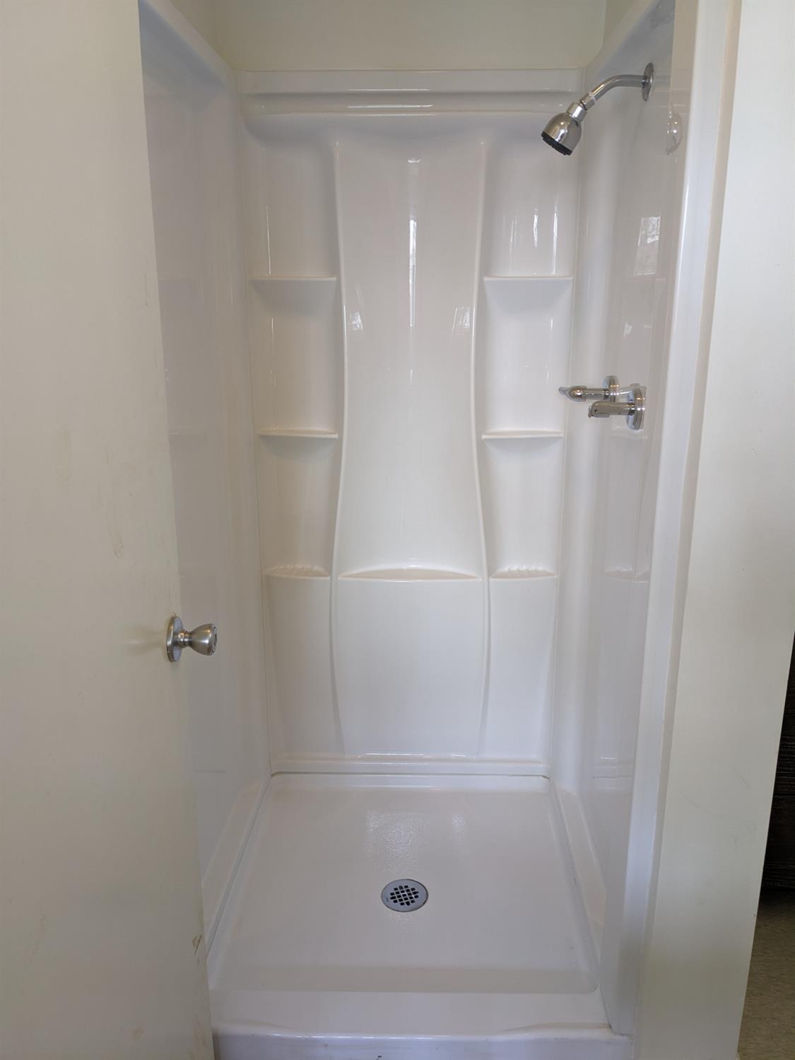 3607 Periwinkle Court Bakersfield, CA 93307 - Photo 8 of 13 a bathroom with a shower