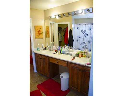 9353 Roping Cowboy Avenue Las Vegas, NV 89178 - Photo 13 of 22 Master Bath/Spa. MASTER BATH WITH WALKING IN CLOSET LEADING FROM MASTER BEDROOM