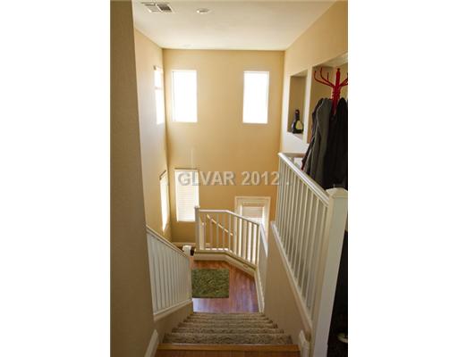 9353 Roping Cowboy Avenue Las Vegas, NV 89178 - Photo 18 of 22 Interior Space/Layout. FROM 2ND FLOOR LEADING TO DOWNSTAIRS FAMILYROOM W/WOOD FLOORS