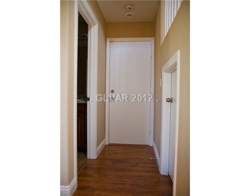 9353 Roping Cowboy Avenue Las Vegas, NV 89178 - Photo 19 of 22 Interior Space/Layout. HALLWAY LEADING TO GARAGE/WITH A FULL BATHROOM & STORAGE AREA