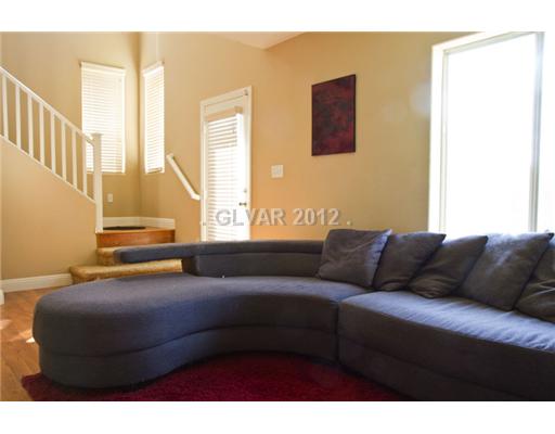 9353 Roping Cowboy Avenue Las Vegas, NV 89178 - Photo 20 of 22 Interior Space/Layout. DOWNSTAIRS FAMILYROOM WITH AN ENTRANCE TO BACKYARD