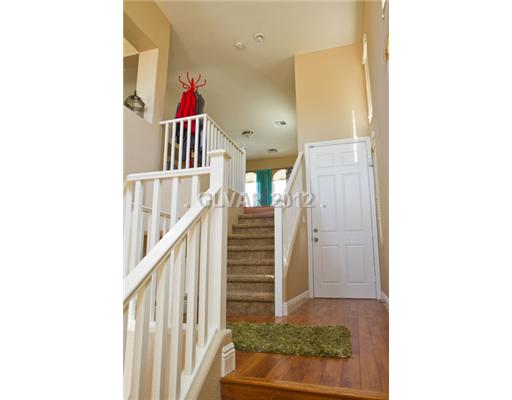 9353 Roping Cowboy Avenue Las Vegas, NV 89178 - Photo 2 of 22 Interior Space/Layout. WOOD FLOOR ENTRANCE LEADING UP TO 2ND FLOOR