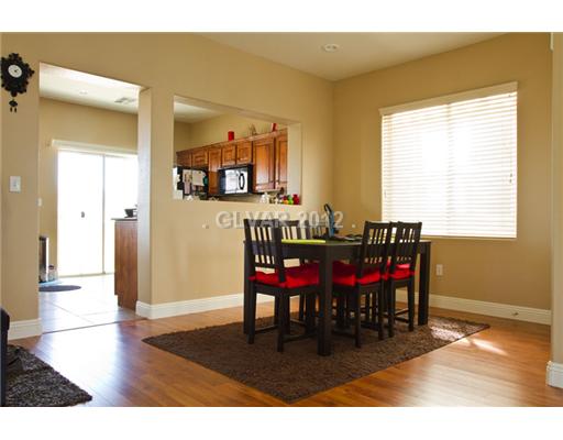 9353 Roping Cowboy Avenue Las Vegas, NV 89178 - Photo 3 of 22 Dining Room. HARDWOOD FLOORS SEPARATE DININGROOM LEADING INTO THE KITCHEN