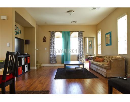 9353 Roping Cowboy Avenue Las Vegas, NV 89178 - Photo 6 of 22 Living Room. UPSTAIRS FAMILYROOM W/HARDWOOD FLOORS