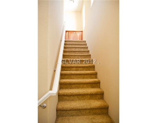 9353 Roping Cowboy Avenue Las Vegas, NV 89178 - Photo 9 of 22 Interior Space/Layout. STAIRS LEADING TO 3RD FLOOR BEDROOMS