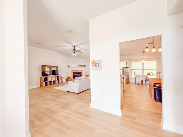 a view of a livingroom with furniture and a flat screen tv