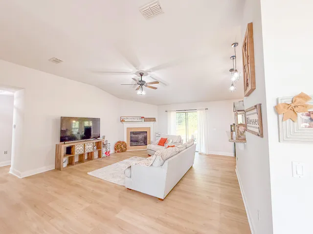 a living room with furniture or couch and a flat screen tv