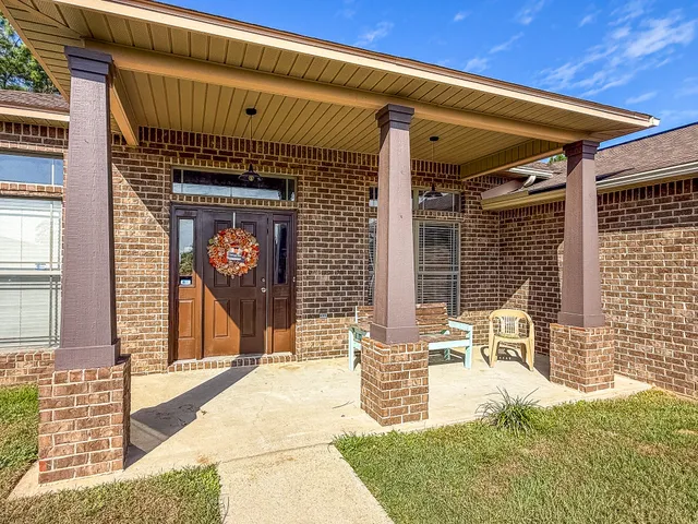 a front view of a building with outdoor seating