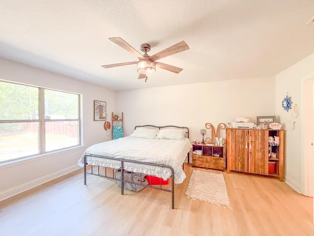 a bed room with a bed and a book shelf