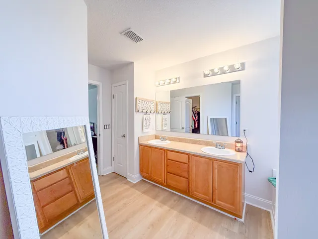 a room with a sink and a mirror