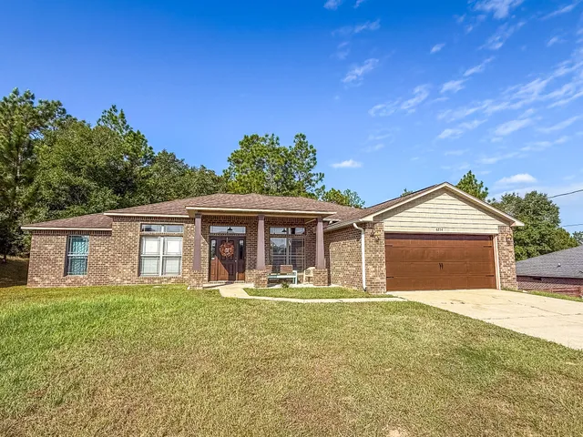 front view of a house with a yard