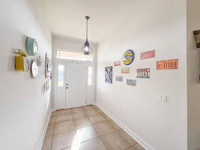 a view of an entryway with front door