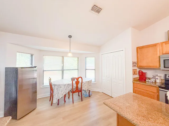a view of a dining room with furniture