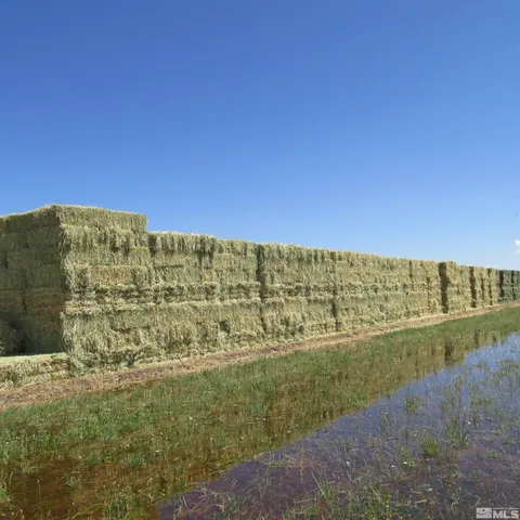 a view of an ocean with a building in the background
