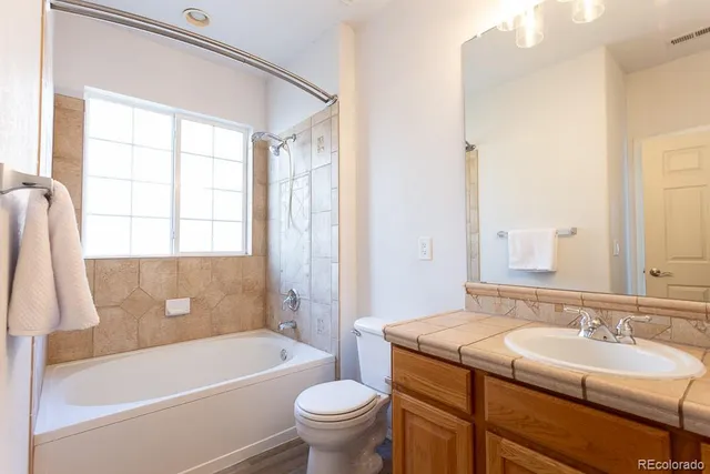 a bathroom with a sink toilet and bathtub
