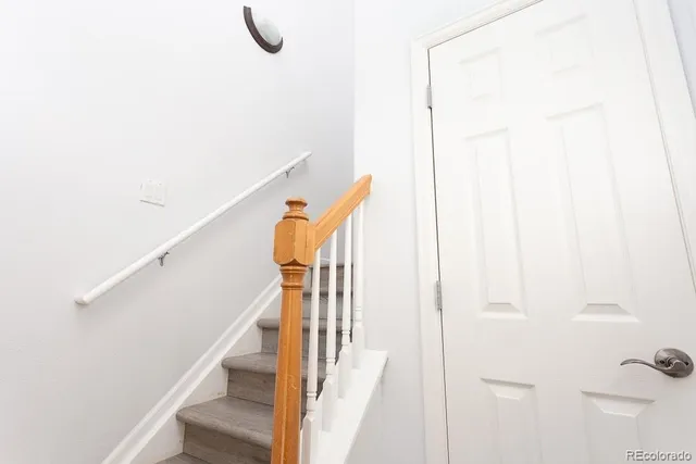 a view of staircase with wooden floor