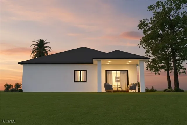 a view of a house with backyard and garden