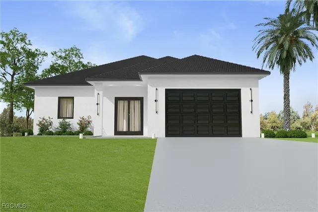 a front view of a house with a yard and garage