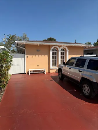 a view of a car parked in front of a house