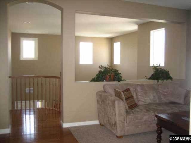 571 Secretariat Court Reno, NV 89521 - Photo 6 of 9 a living room with furniture and wooden floor