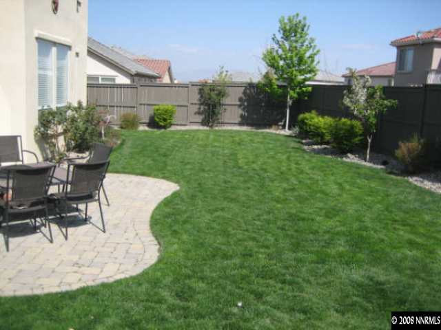 571 Secretariat Court Reno, NV 89521 - Photo 8 of 9 a view of a house with backyard sitting area and garden