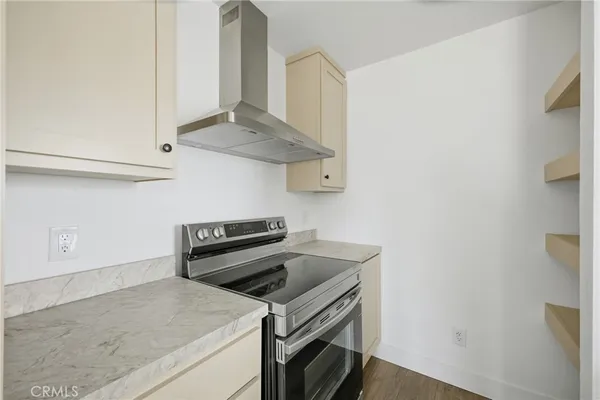 a kitchen with a stove and a microwave