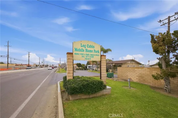 a view of a street with a building in the background