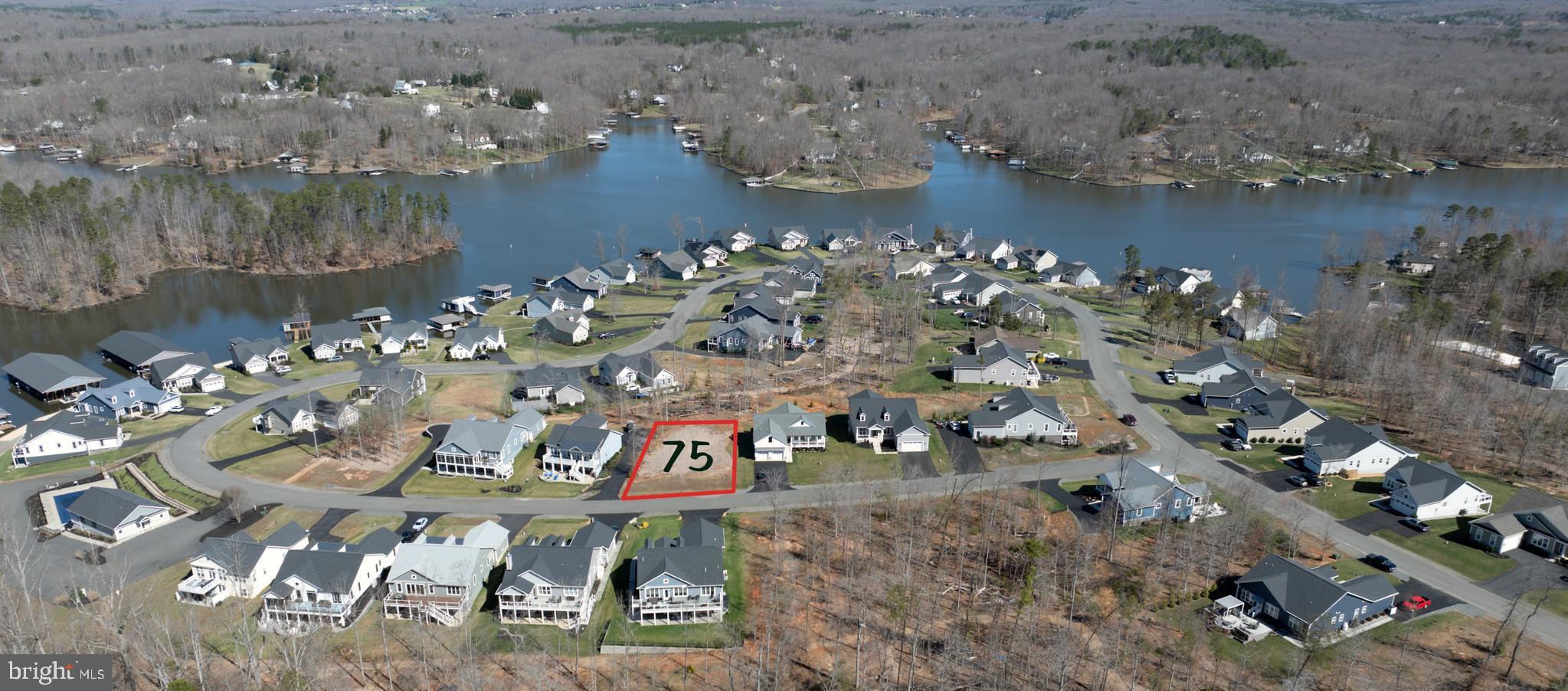 an aerial view of a house with a lake view
