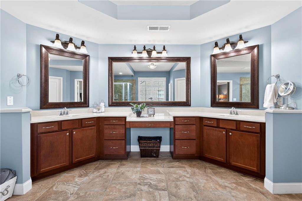 340 Scott Farm Drive Powder Springs, GA 30127 - Photo 27 of 59 a spacious bathroom with a sink double vanity and a large mirror