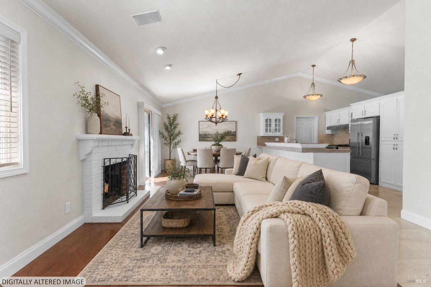 2177 Vista Del Rancho Fairfield, CA 94534 - Photo 3 of 28 a living room with furniture a fireplace and a chandelier