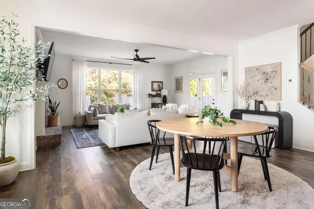 a view of a dining room with furniture window and wooden floor